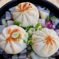 Pan Seared Black Pepper Beef Bao · These baos are filled with beef.  After they are steamed, they are seared with a touch of bu...