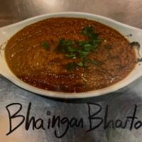 Bhaingan Bharta · Traditionally cooked eggplant.(Served Mild Can Be Made Medium/Very/orExtra Spicy if requeste...