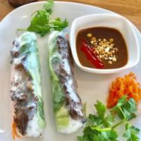 A6. Grilled Beef Spring Rolls · Grilled beef, lettuce, vermicelli, cucumber, carrot, cilantro and basil.
