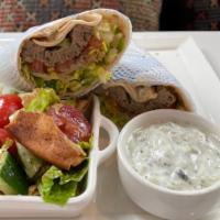 Gyro · Beef and lamb, tzatziki, feta cheese, lettuce, onion, tomato and a side salad