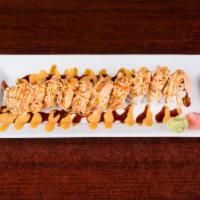 15. Grizzly Roll · Shrimp tempura, spicy crab meat inside, crab meat on top with spicy mayo and eel sauce.