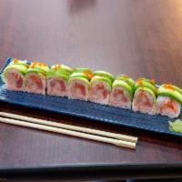 31. Sushi Koi Roll · Tuna, salmon, white fish, super white tuna wrap w/ soy bean paper, topped with snow crab, av...