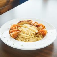 Alfredo Pasta Plate · Chicken or shrimp over fettuccine noodles.