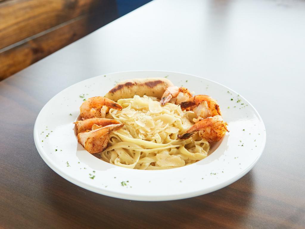 Alfredo Pasta Plate · Chicken or shrimp over fettuccine noodles.