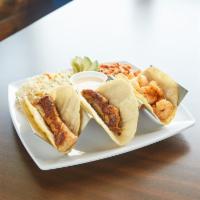 SS Tacos Plate · Fish or shrimp inside corn tortillas with rice and spicy coleslaw.