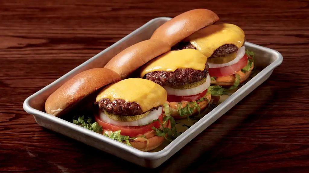 Paul's Sliders · Three 2 oz. burgers, government cheese, pickles, onion, tomatoes, lettuce, and Paul's signature Wahl sauce.  1100 calories.