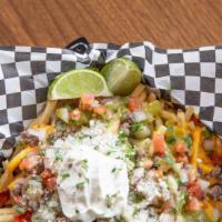 Carne Asada Fries · Crispy golden fries topped with fresh grilled carne asada beef,  house made pico de gallo, c...