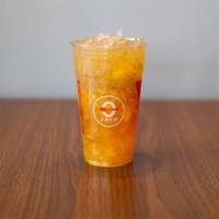 Peach Blossom · Refreshing peach-citrus green tea topped with fresh peaches and chia seeds.