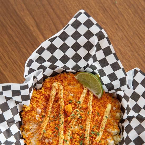 Cheddar Jalapeño Cheetos Elotes · Grilled corn topped with mayonnaise, cotija cheese, dusted with red chile powder and served with a lime wedge and with Cheddar Jalapeño Cheetos to top it all off!