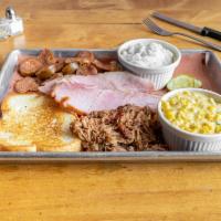 The Whole Hog · Pulled pork, pit ham, smoked sausage, and 2 sides. Comes with Texas toast and pickles.
