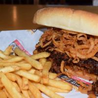 The Chop Sandwich · All of our chopped meats smothered in BBQ sauce. Topped with onions straws.
