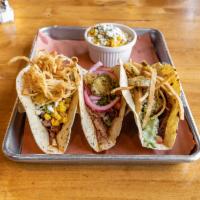 3 Piece Cowboy Street Tacos · Pork carnitas with pickled red onions, fried jalapenos, cotija cheese, pico, and cilantro. B...