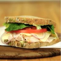 Turkey Pesto Sandwich · Freshly sliced Turkey and pesto sauce with provolone
cheese on toasted Sourdough bread. Topp...