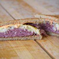 The Reuben Sandwich · Pastrami, Swiss cheese, sauerkraut, & Thousand Island
dressing grilled on caraway rye.