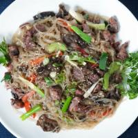 Jobchae 잡채 · Potato starch noodles stir-fried with vegetables and beef.