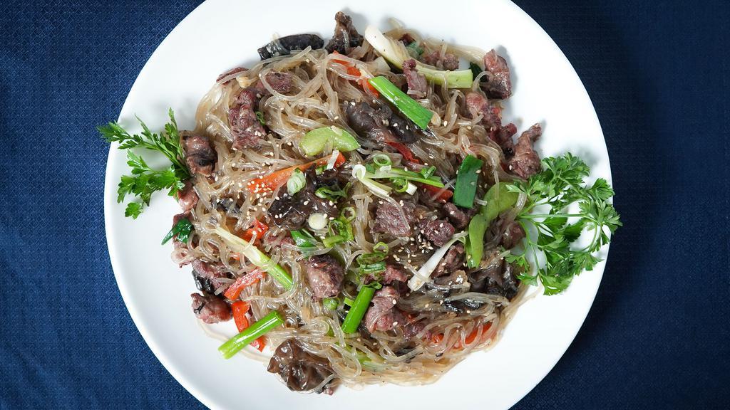 Jobchae 잡채 · Potato starch noodles stir-fried with vegetables and beef.