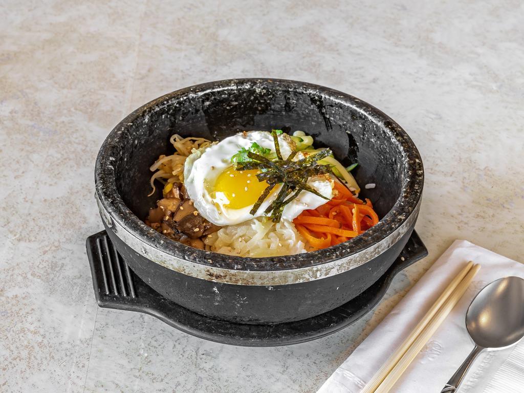 Bi Bim Bap 비빔밥 · Steamed rice served with vegetables, and egg.