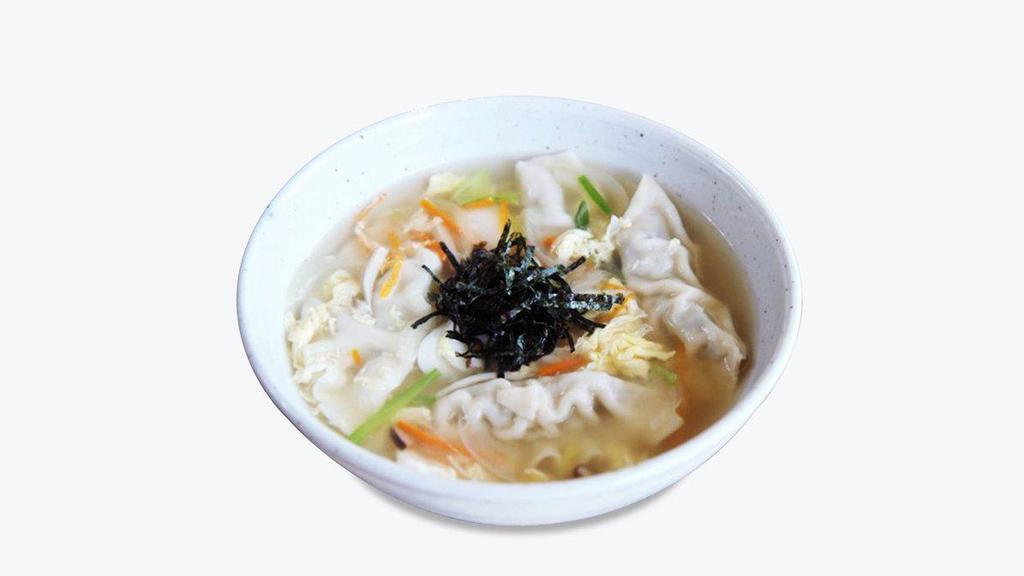 Dumpling Soup 만두국 · 8 pieces of dumplings and glass noodles in beef broth.