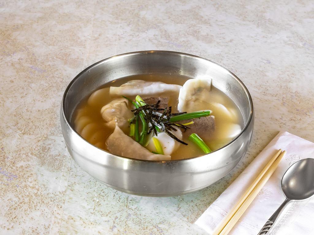Sliced Rice Pasta Soup with Dumplings 떡만두국 · Sliced rice pasta soup with 3 pieces of dumplings and glass noodles in beef broth.