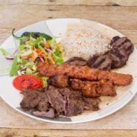 Alev Mixed Kebab Platter · Combination of shish, adana, kofte kebabs and homemade gyro. Served with grilled tomato, pep...