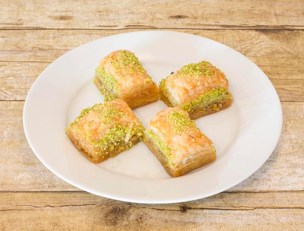 Baklava · Rich, perfectly sweetened thin layers of phyllo filled with finely chopped pistachios, held together with just the right amount of honey syrup.