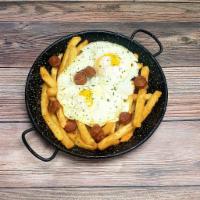 Huevos Rotos con Chistorra · 2 sunny side up eggs over mini Spanish pork sausage and french fries.