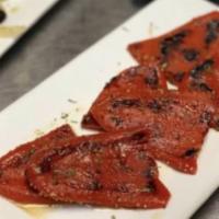 Piquillos Rostizados · Grilled red piquillos peppers.