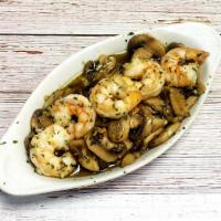 Gambas con Champis al Ajillo · Sizzling shrimp sauteed with mushrooms with slices of garlic in olive oil.