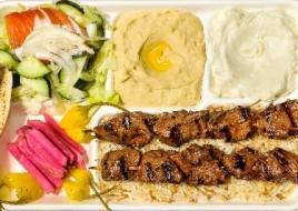 Shish Kabob Plate · Marinated filet Mignon served with french fries or rice, salad, hummus, garlic sauce, pickles and 2 pieces of pita bread.
