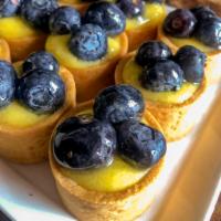 Lemon Blueberry Tarts (6 ea) · crunchy vanilla tart filled with our house made lemon curd and topped with agave coated blue...