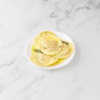 Ravioli di Zucca · Butternut squash ravioli in a butter, sage and Parmesan sauce.