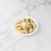 Gnocchi Gorgonzola · Fresh gnocchi in creamy gorgonzola cheese, walnuts and arugula.