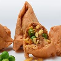 Vegetable Samosa · Deep fried pastry tucked and stuffed with cooked potatoes.


