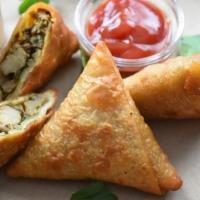 Keema Samosa · Deep fried pastry tucked and stuffed with cooked fresh minced lamb.

