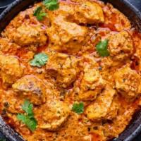 Chicken Tikka Masala · Roasted Chicken breast cubes cooked in a mild tomato and onion cream sauce.

