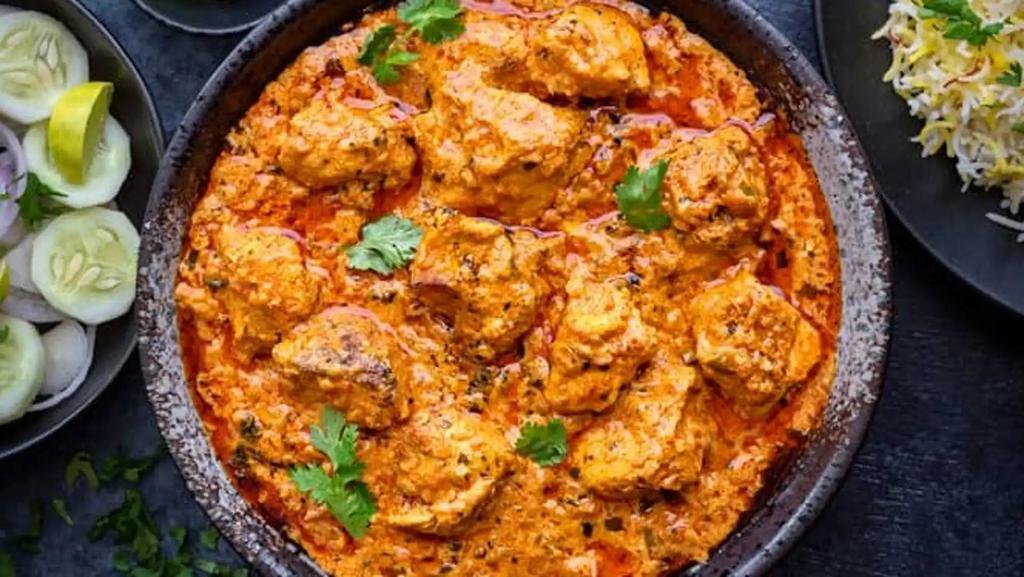 Chicken Tikka Masala · Roasted Chicken breast cubes cooked in a mild tomato and onion cream sauce.

