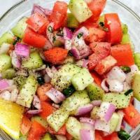 Kachumber Salad · Chopped cucumber, carrot, and onion salad.


