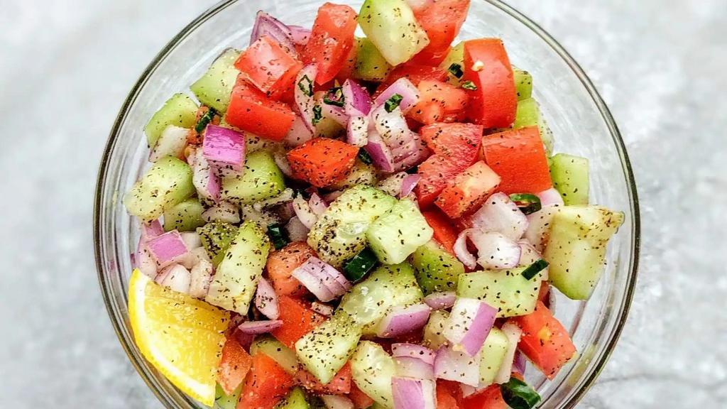 Kachumber Salad · Chopped cucumber, carrot, and onion salad.

