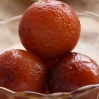 Gulab Jamun · Deep-fried dumplings/donuts made of dried milk [khoya] are dipped in a rose-cardamom flavore...