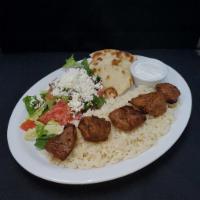 Lamb Shish Kebab · Cubed marinated lamb meat. Served with rice, Greek salad, pita, and tzatziki sauce.