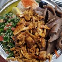 Gyro and Chicken Bowl  · 
Lamb and Beef gyro , Chicken Shawarma . our best in one plate