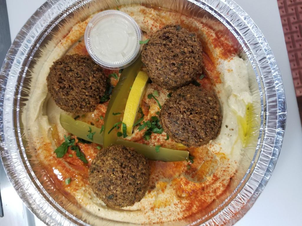 Falafel Bowl  · Fresh ground garbanzo beans with herbs and spices . fried to order