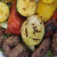 Lamb Kabob and Roasted Veggie  Plate · Lamb kabob and mix of veggie and Rice   topped with your choice of sauce.