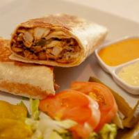 Panini Chicken Shawarma · Thin sliced Chicken Shawarma Wrapped in Saj thin Bread with Pickles  and House Garlic  Sauce...