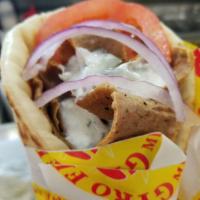 Greek Gyro (Flatbread) · Beef and lamb gyro served with lettuce, tomato, onion, feta cheese and tzatziki sauce in  so...