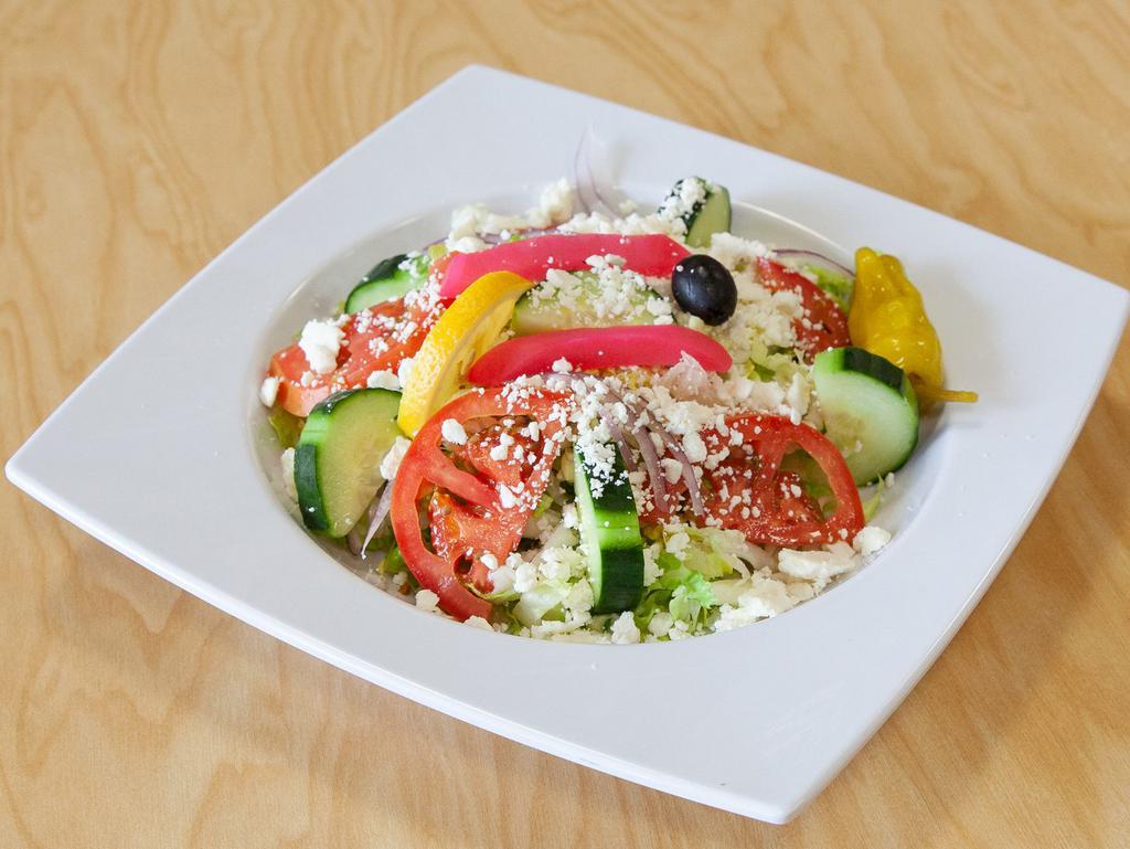 Feta Salad · Romaine lettuce, tomatoes, cucumbers, onions, olives, tzatziki, and feta cheese.