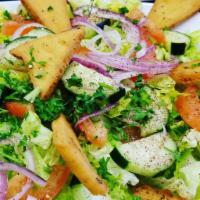 Fatoosh Salad · Romaine lettuce, tomatoes, cucumbers, onions, sumac, fried pita bread and house dressing.