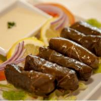 Grape Leaves · Grape leaves stuffed with rice and tomato. Vegan.