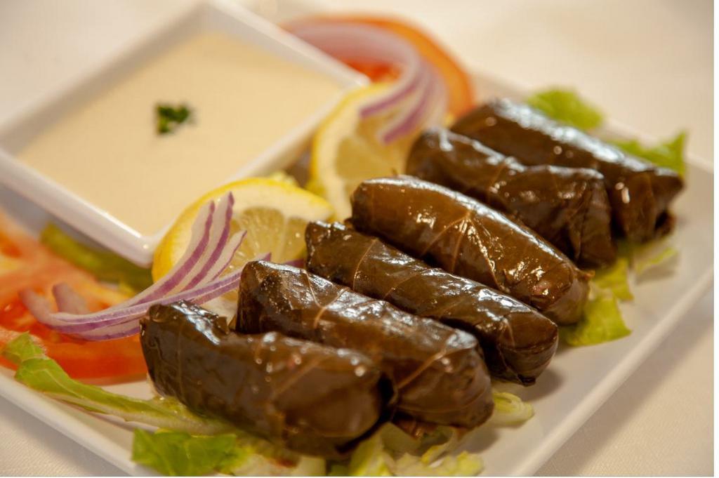 Grape Leaves · Grape leaves stuffed with rice and tomato. Vegan.