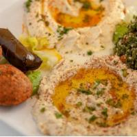 Veggie Mezza with Pita Bread · Hummus, baba ghanoush, falafel, grape leaves, and tabbouleh. Vegetarian.